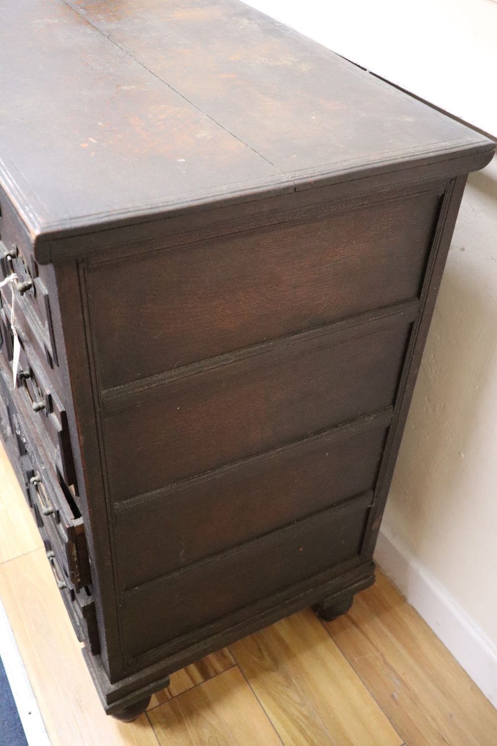 An early 18th century oak chest with hinged top, width 84cm, depth 45cm, height 85cm